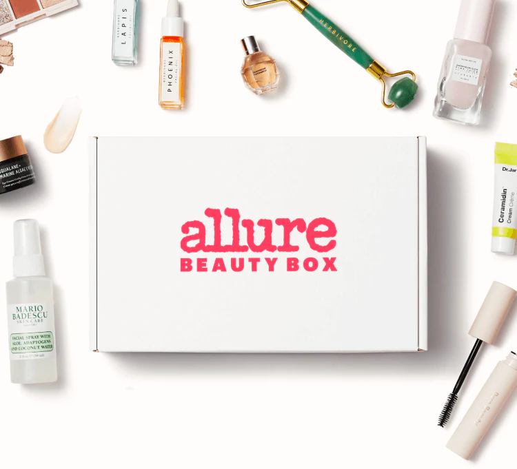 Current Allure Beauty Box with various products scattered outside the box.